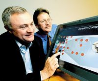 Стив Миллз, глава IBM Software, и Джон Келли, старший вице-президент IBM Research, наблюдают за работой системы Stream Computing