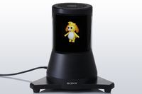 Экран закреплен на круглой черной подставке и своим внешним видом немного напоминает небольшой блендер 